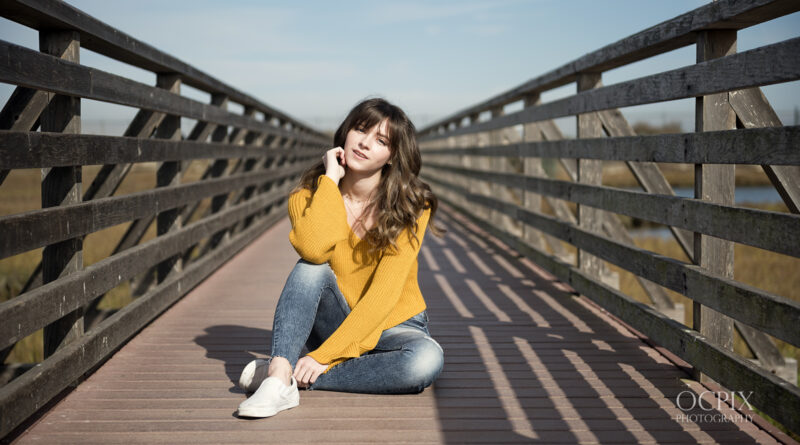 Model Probst sitting on the Bolsa Chica Wetlands wooden bridge