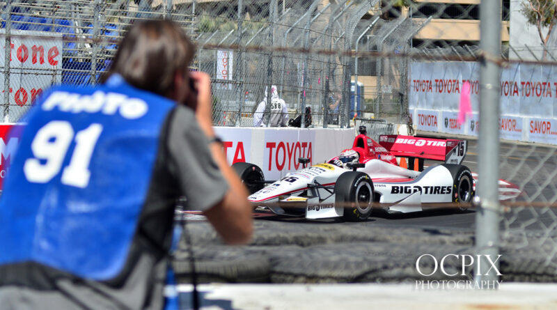 Photographers inside scoop while photographing grand prix